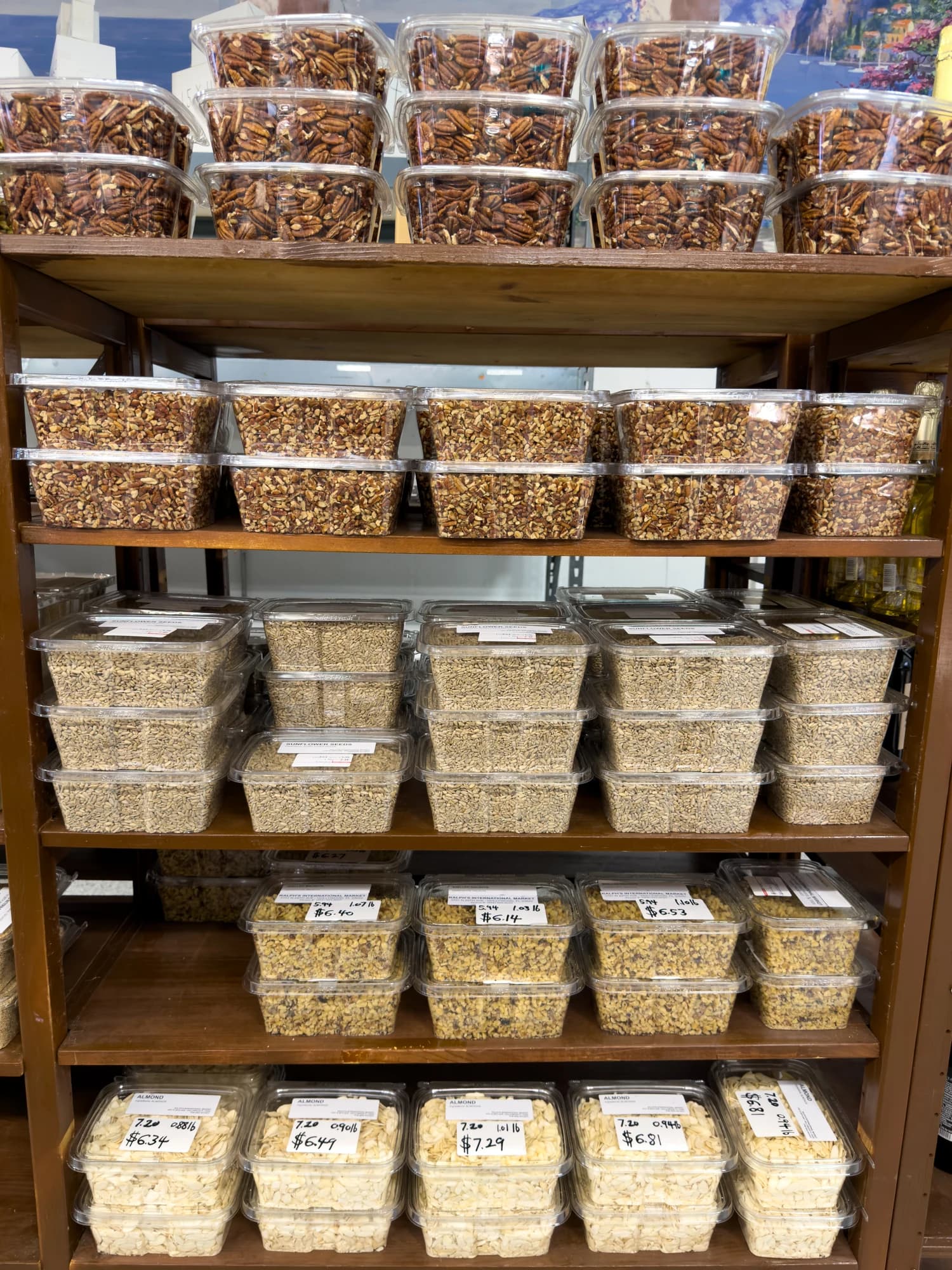 Pecans, almonds, and seeds in bulk containers at Ralph’s