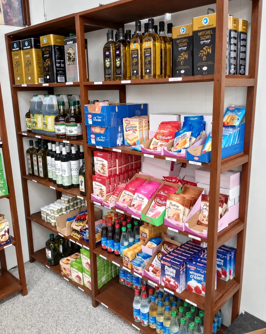 Olive oils and baking ingredients on the shelves at Ralph's
